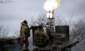 Ukrainian service personnel fire an anti-aircraft cannon