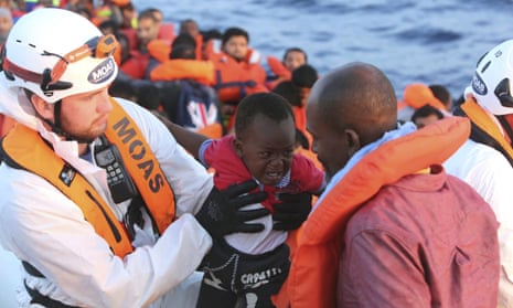 A child cries while being rescued