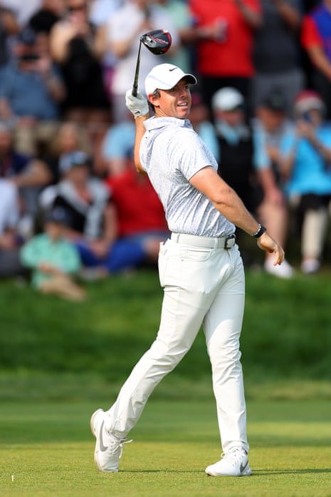 Rory McIlroy of Northern Ireland plays his shot from the 14th tee.