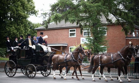A horse-drawn carriage passes by on the fourth day at Royal Ascot.
