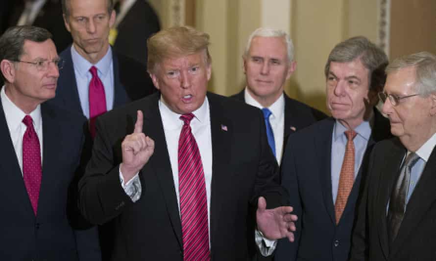 In a picture from January 2019, senior Republicans John Barrasso, John Thune, Mike Pence, Roy Blunt and Mitch McConnell listen as Donald Trump makes a point.