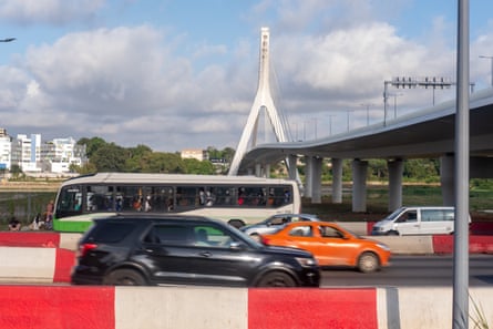Cars driving along a busy road