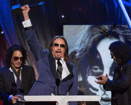 Ace Frehley at the ceremony to induct Kiss into the Rock and Roll Hall of Fame in Brooklyn, New York, 2014 – standing behind Frehley are Paul Stanley and Gene Simmons.