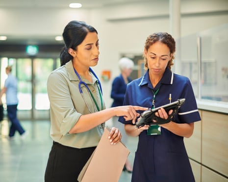 hospital colleagues checking medical records database staff nurse consulting ward doctor
