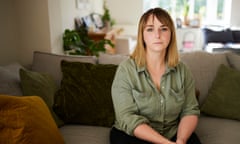 Crystal Owen is seen in her living room; she has green eyes and straight, mid-length light brown and blond hair, and is wearing a khaki-green shirt with large pockets; she sits on a soft grey sofa with green and mustard-coloured cushions, with a window behind her.  She is looking straight at the camera with a serious expression.