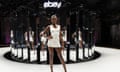 Leomie Anderson stood on a white catwalk with a circle of mirrors behind her