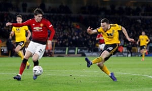 Diogo Jota escapes the attentions of Victor Lindelöf to fire home Wolves’ decisive second goal at Molineux.