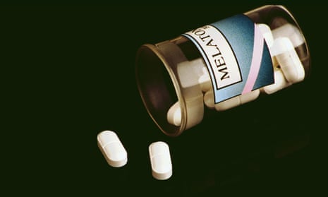 melatonin bottle and pills