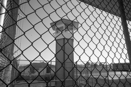 view of a tower through a chain link fence