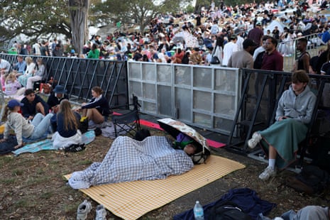 People sleep at Mrs Macquaries Point ahead of the New Year’s Eve fireworks in Sydney.