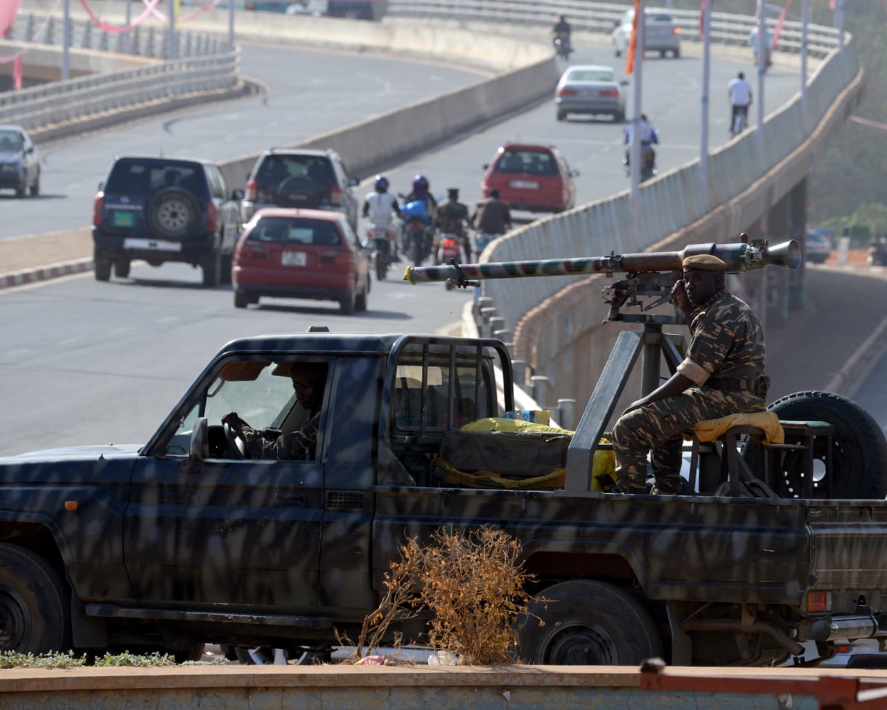 Soldiers patrol in the streets of Niamey
