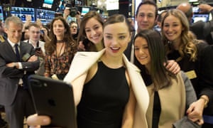 Miranda Kerr, the Australian model, takes a selfie with friends at the opening bell at the New York Stock Exchange on Thursday. Kerr is the partner of Snapchat boss Evan Spiegel.