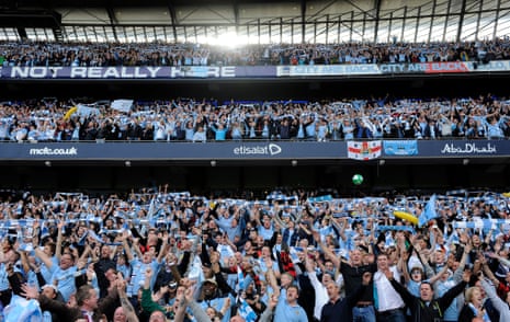 Manchester City fans celebrate winning the title shortly after the final whistle against QPR in 2012.