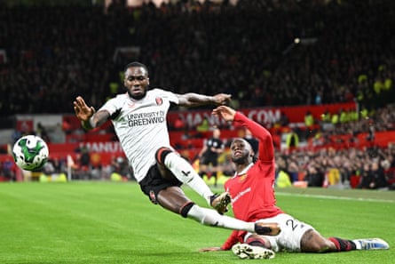 The Manchester United defender Aaron Wan-Bissaka (right) tackles Charlton’s midfielder Corey Blackett-Taylor.