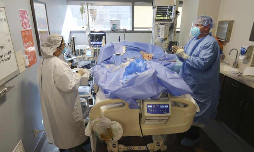 Nurses tend to a patient in the Covid-19 intensive care unit in Bakersfield, California.