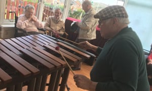 Older people playing xylophone