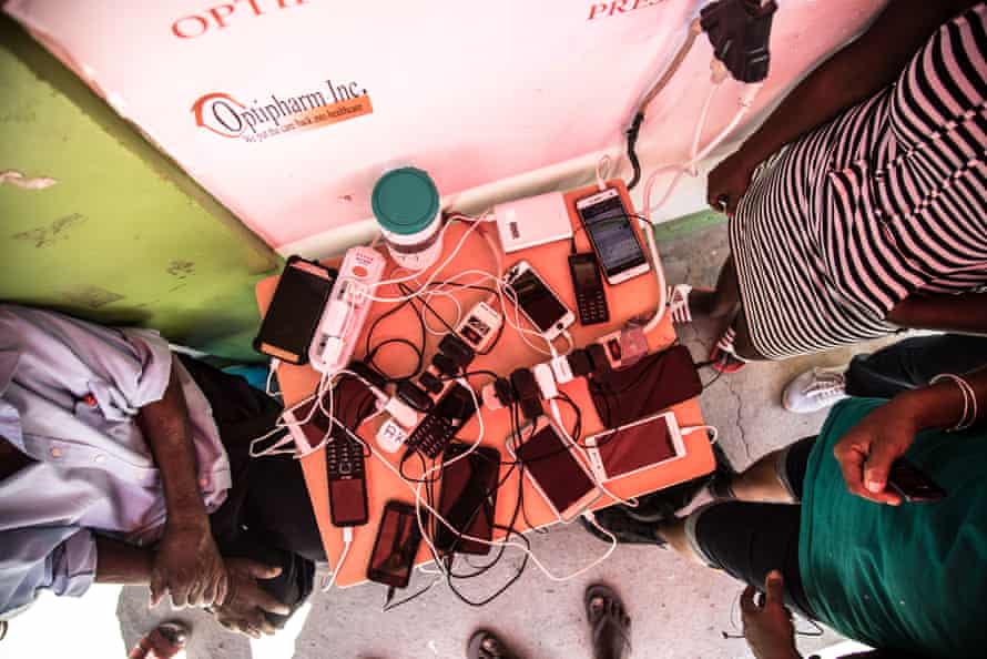 A plug dangling from a private clinic becomes a vital charging station. With power out across 99% of the island, residents are desperate to charge their phone to communicate with friends and family abroad or across Dominica.