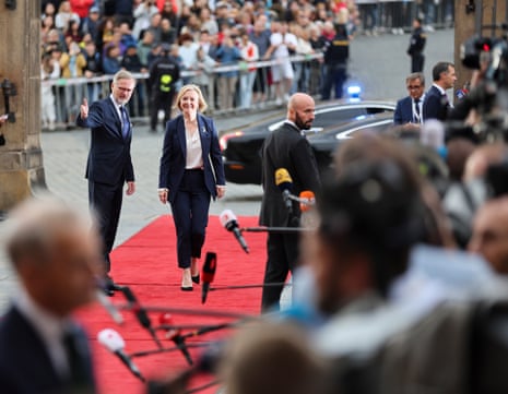 Liz Truss being welcomed by the Czech Republic’s prime minister, Petr Fiala, as she arrives for the first meeting of the European Political Community in Prague.