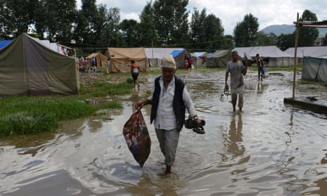 Nepalese earthquake victims at a temporary shelter after monsoon rains on the outskirts of Kathmandu. Micro-insurance schemes can offer a safety net for families after emergencies. 