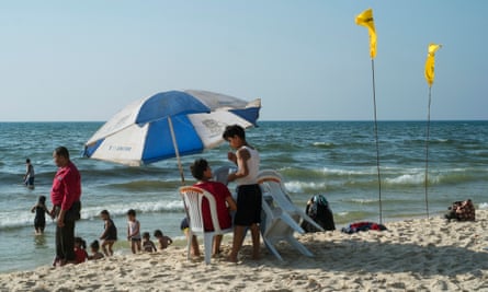 Families on one of Gaza beaches where almost 73 percent of the coastline is currently contaminated with sewage because of the strip’s ongoing electricity crisis.
