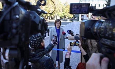 Moldova’s incumbent president, Maia Sandu, speaks with journalists after taking part in a televised election debate ahead of a presidential runoff in Chișinău