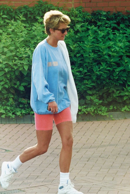 a woman wearing shorts walks