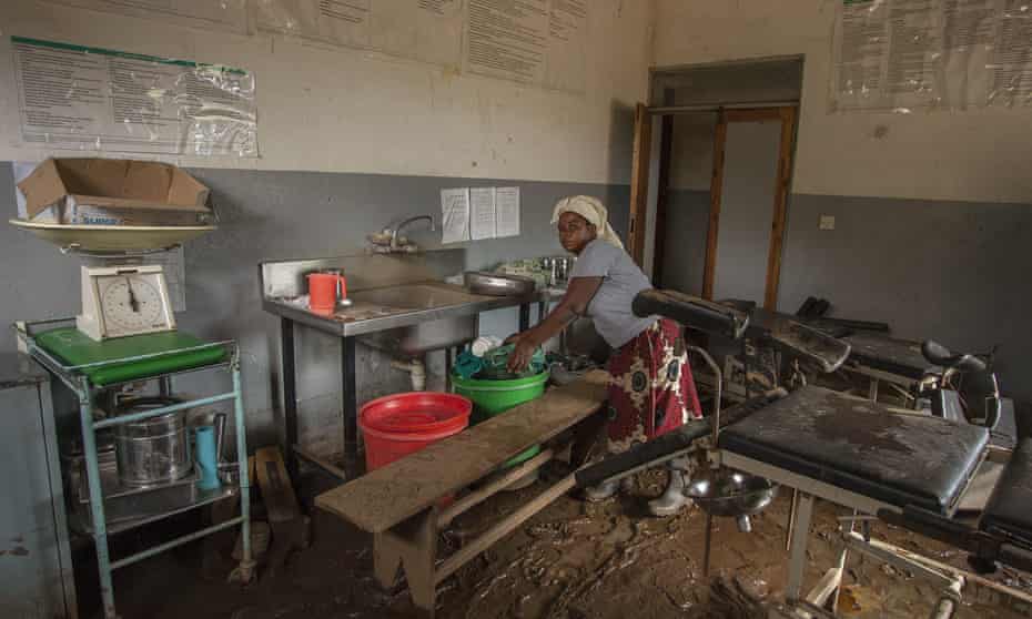 A nurse clears medical equipment at a health centre in Makhanga damaged by flooding in January 2015