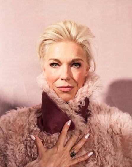 Portrait of Hannah Waddingham with her blond hair brushed back and wearing a shearling coat