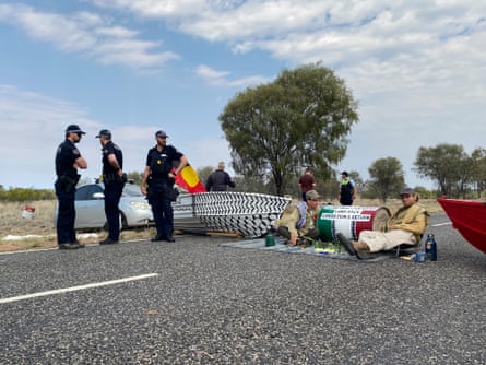 Protesters block the road leading into Pine Gap