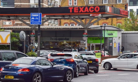 Cars queue at a petrol station in central London. Many stations in the UK ran out of petrol due to a shortage of truck drivers.