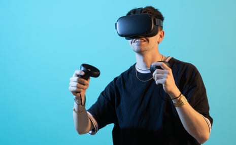 a young man wears the oculus quest headset