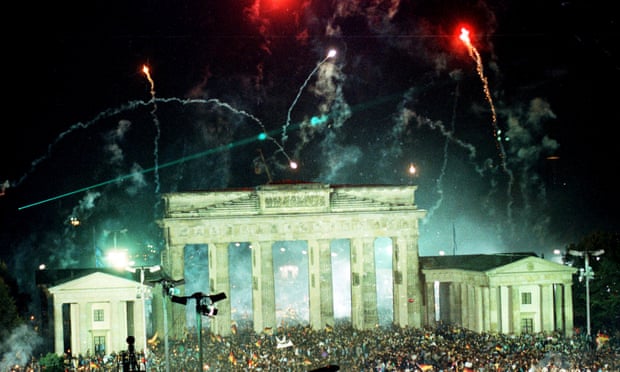 Fireworks exploding over the Brandenburg Gate in Berlin on 3 October 1990 as tens of thousands gathered to celebrate the reunification of the two Germanys.