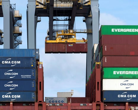 Containers are loaded onto a ship at the port of Rotterdam, the Netherlands.