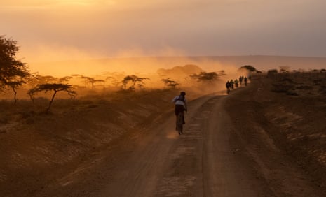Riding through the stunning Maasai Mara on stage 2 in the Migration Gravel Race in Kenya.