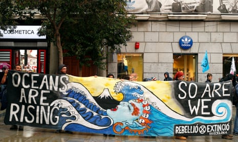 Extinction Rebellion campaigners with a long banner
