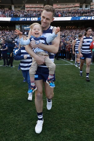 Joel Selwood of the Cats leads his team out while carrying Levi Abblett, who suffers from a rare degenerative illness. The youngster is the son of Cats legend Gary Ablett Jr and follows in his father’s, and grandfather’s, footsteps by taking to the field at an AFL grand final.