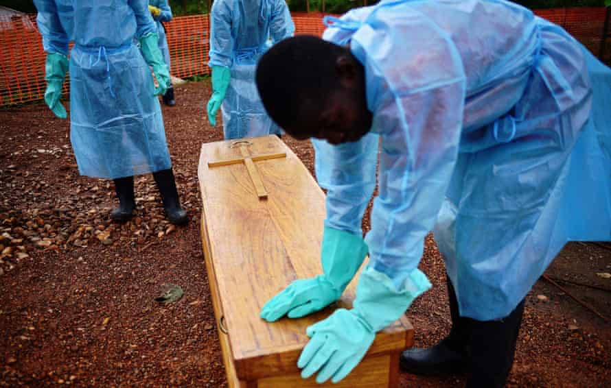 Sierra Leone government burial team members with coffin