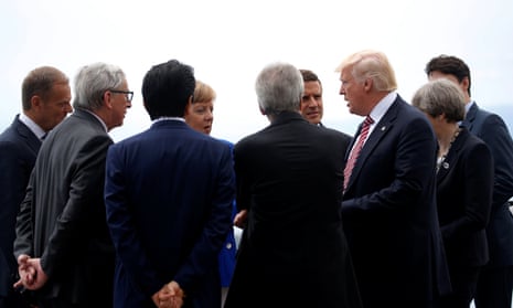 Donald Trump speaks with fellow G7 leaders at the summit in Taormina.