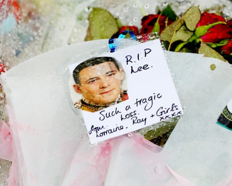 Floral tributes and a photograph of Lee Rigby with a message reading 'RIP Lee. Such a tragic loss'