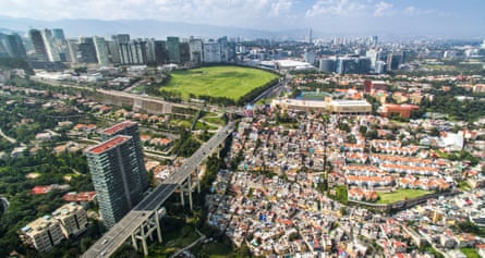 An aerial view of Mexico City which illustrates the stark divide in housing between rich and poor neighborhoods.