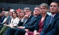 Peter Mandelson (centre) listens as the shadow chancellor Rachel Reeves delivers her keynote speech to the Labour Party Conference in Liverpool.