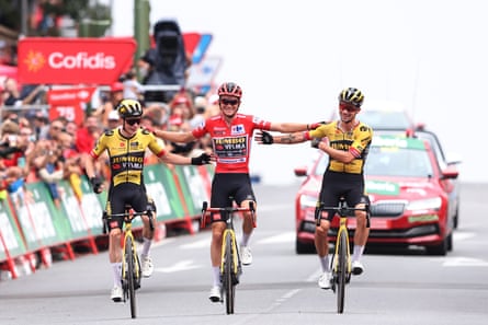 Jonas Vingegaard, Sepp Kuss and Primoz Roglic cross the finishing line of the Vuelta a España’s penultimate stage