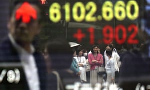 An electronic board shows the stock indicator of a securities firm in Tokyo.