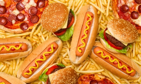 Overhead view of burgers, hotdogs and pizzas