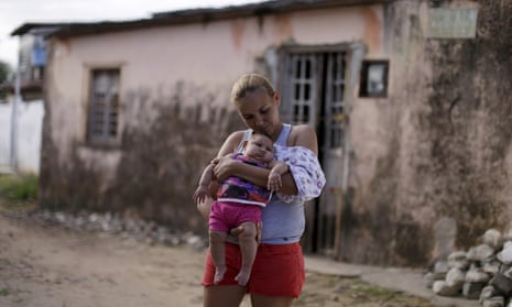 A girl with microcephaly and her mother in Brazil