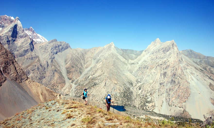 Trekkers on a high ridge in the Fann mountains of Tajikistan.