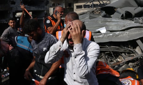 Israel-Hamas war live: White House promises ‘continued flow’ of Gaza aid as Israel steps up airstrikes in north of strip | Israel-Hamas war 11 A Palestinian man reacts as the body of his daughter is unearthed from under the rubble after an Israeli strike on Rafah in the southern Gaza Strip on Sunday.
