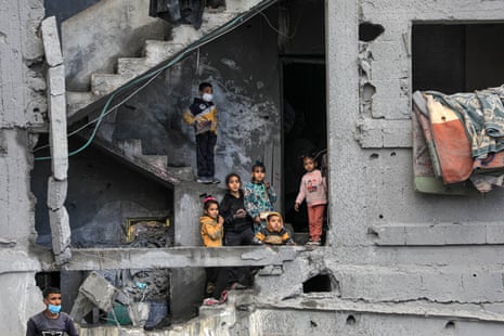 Children in a damaged building in Rafah, Gaza