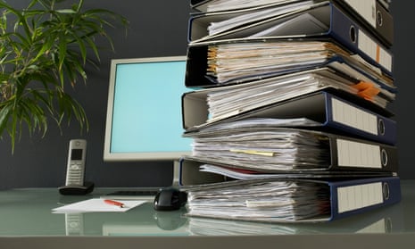 Stack of ring binders on a desk