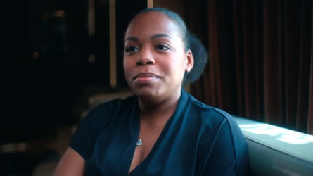 person wearing black sits on sofa